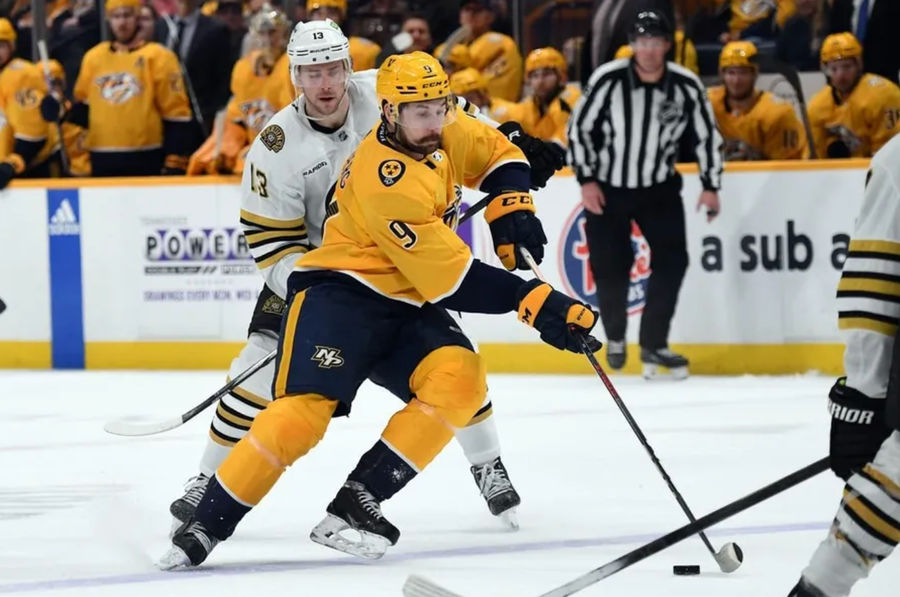 Apr 2, 2024; Nashville, Tennessee, USA; Nashville Predators left wing Filip Forsberg (9) skates the puck into the offensive zone during the third period against the Boston Bruins at Bridgestone Arena. credits: Christopher Hanewinckel-USA TODAY Sports