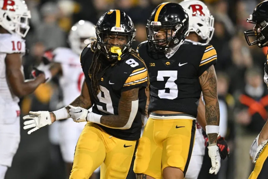 Nov 11, 2023; Iowa City, Iowa, USA; Iowa Hawkeyes running back Jaziun Patterson (9) and wide receiver Kaleb Brown (3) react after a touchdown by Patterson against the Rutgers Scarlet Knights during the fourth quarter at Kinnick Stadium. credits: Jeffrey Becker-USA TODAY Sports