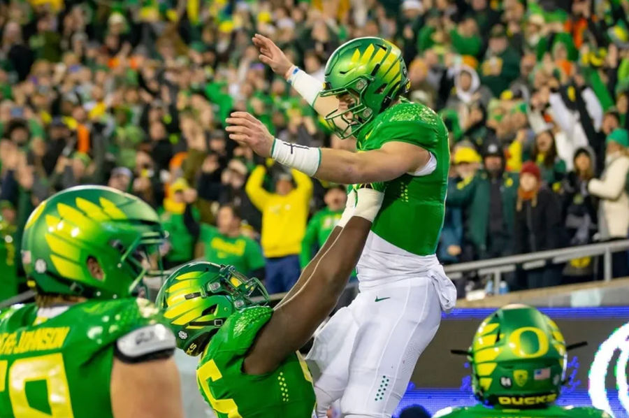 Former Oregon quarterback Bo Nix is hoisted into the air after a touchdown as the No. 6 Oregon Ducks take on the No. 16 Oregon State Beavers Friday, Nov. 24, 2023, at Autzen Stadium in Eugene, Ore. credits: Ben Lonergan/The Register-Guard / USA TODAY NETWORK