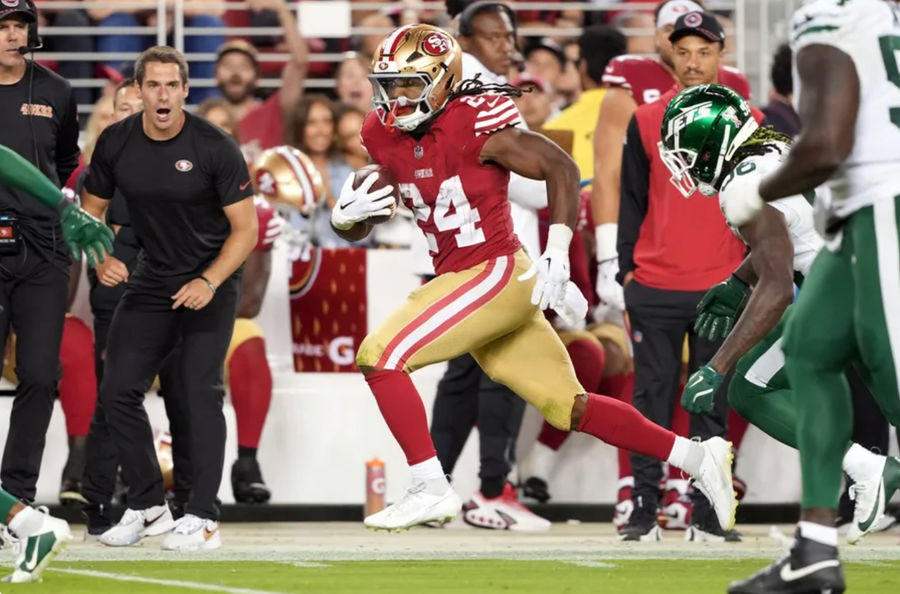 Sep 9, 2024; Santa Clara, California, USA; San Francisco 49ers running back Jordan Mason (24) carries the ball against New York Jets linebacker Quincy Williams (obscured right) during the fourth quarter at Levi's Stadium. Mandatory Credit: Darren Yamashita-Imagn Images