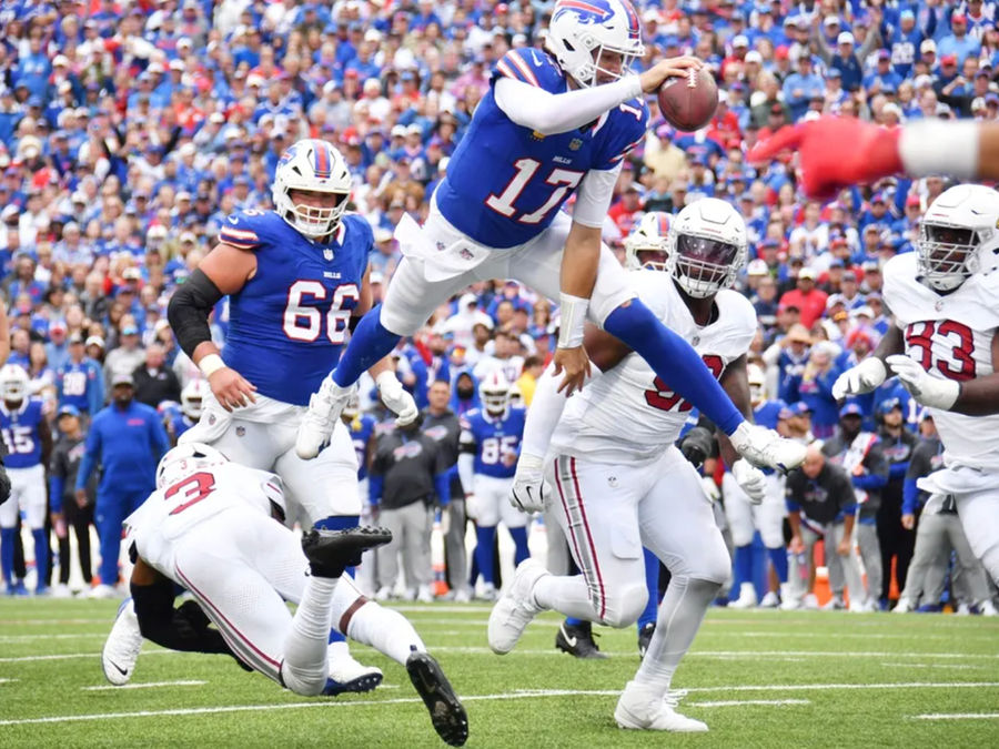 Sep 8, 2024; Orchard Park, New York, USA; Buffalo Bills quarterback Josh Allen (17) leaps for a touchdown against the Arizona Cardinals in the fourth quarter at Highmark Stadium. Mandatory Credit: Mark Konezny-Imagn Images