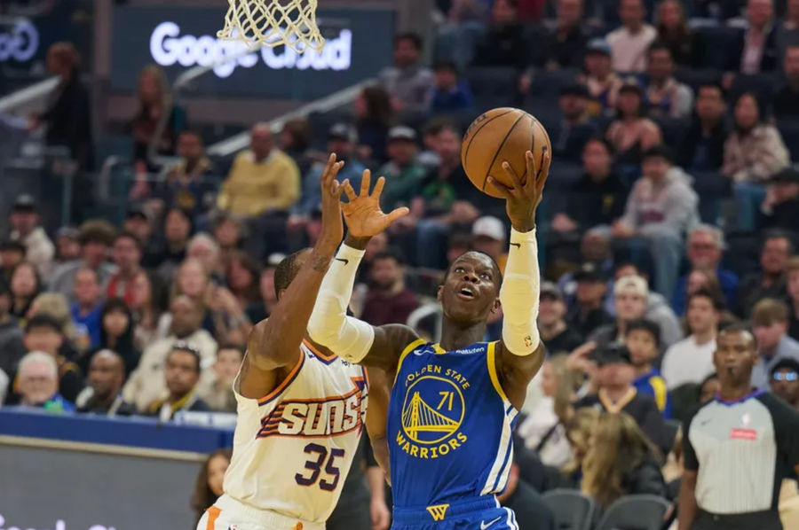 Dec 28, 2024; San Francisco, California, USA; Golden State Warriors guard Dennis Schroder (71) shoots the ball against Phoenix Suns forward Kevin Durant (35) (obscured) during the first quarter at Chase Center. Mandatory Credit: Robert Edwards-Imagn Images
