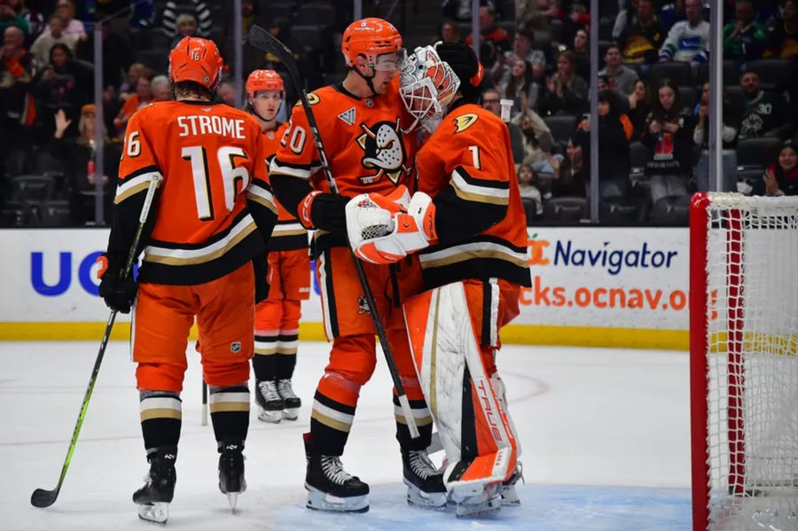Feb 27, 2025; Anaheim, California, USA; Anaheim Ducks center Ryan Strome (16) right wing Brett Leason (20) and goaltender Lukas Dostal (1) celebrate the victory against the Vancouver Canucks at Honda Center. Mandatory Credit: Gary A. Vasquez-Imagn Images