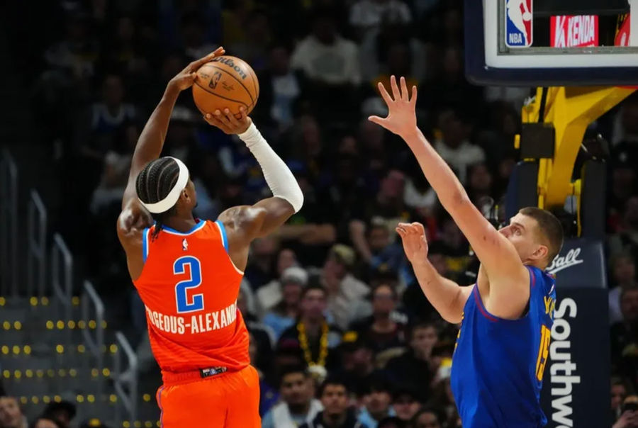 Dec 16, 2023; Denver, Colorado, USA; Oklahoma City Thunder guard Shai Gilgeous-Alexander (2) shoots the ball over Denver Nuggets center Nikola Jokic (15) in the fourth quarter at Ball Arena. Mandatory Credit: Ron Chenoy-USA TODAY Sports
