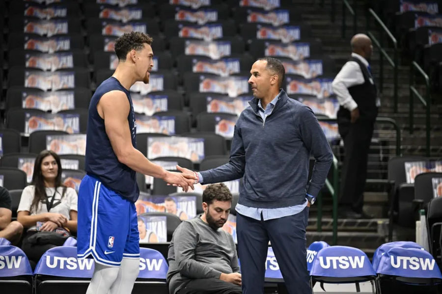 Nov 3, 2024; Dallas, Texas, USA; Dallas Mavericks center Dwight Powell (left) speaks with Mavericks general manager Nico Harrison (right) before the game between the Dallas Mavericks and the Orlando Magic at American Airlines Center. Mandatory Credit: Jerome Miron-Imagn Images