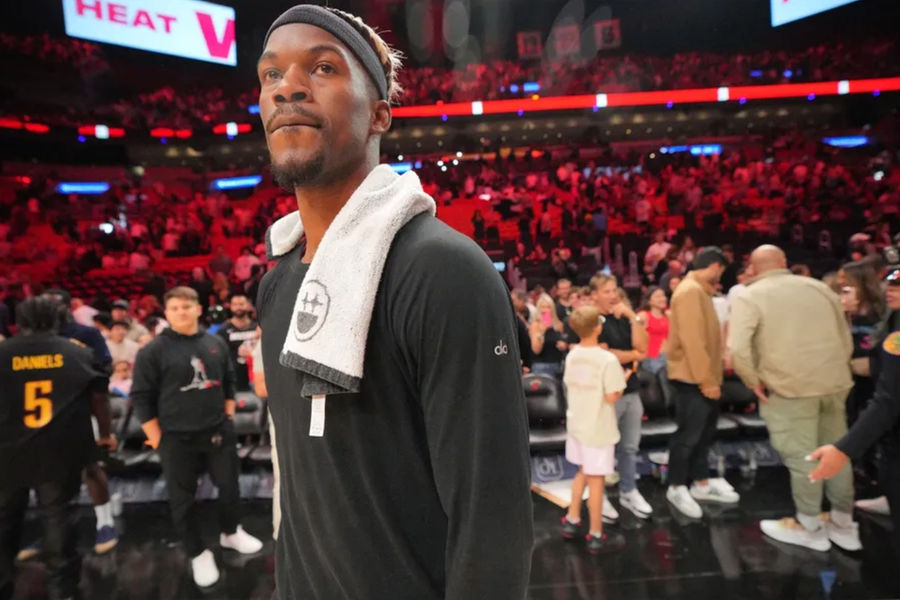 Jan 19, 2025; Miami, Florida, USA; Miami Heat forward Jimmy Butler (22) walks off the court after greeting court-side friends following the victory over the San Antonio Spurs at Kaseya Center. Mandatory Credit: Jim Rassol-Imagn Images